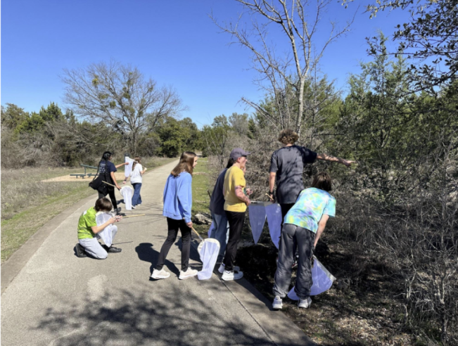 Cedar Valley Middle School students outside with insect nets