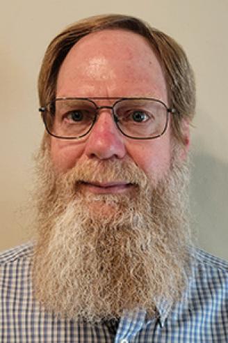 man with beard and glasses